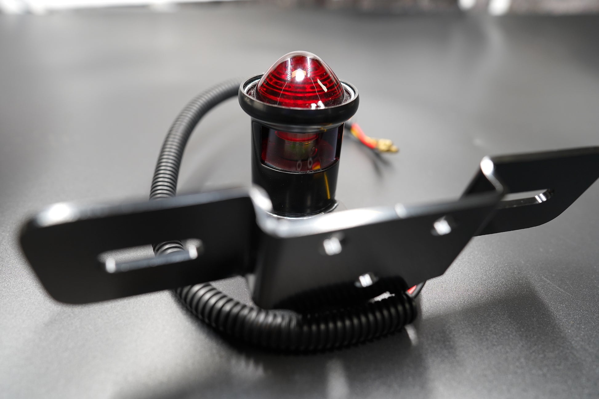 Rear view showing wiring exit and plate mount configuration.