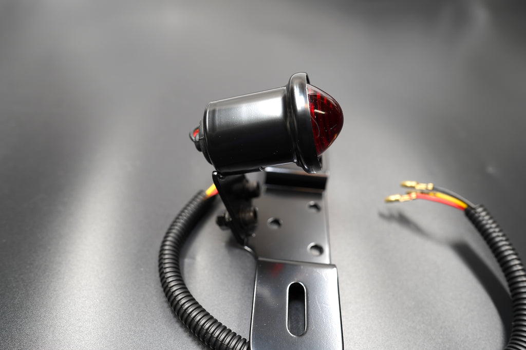 Close-up of smoked red LED lens showing subtle vintage glow