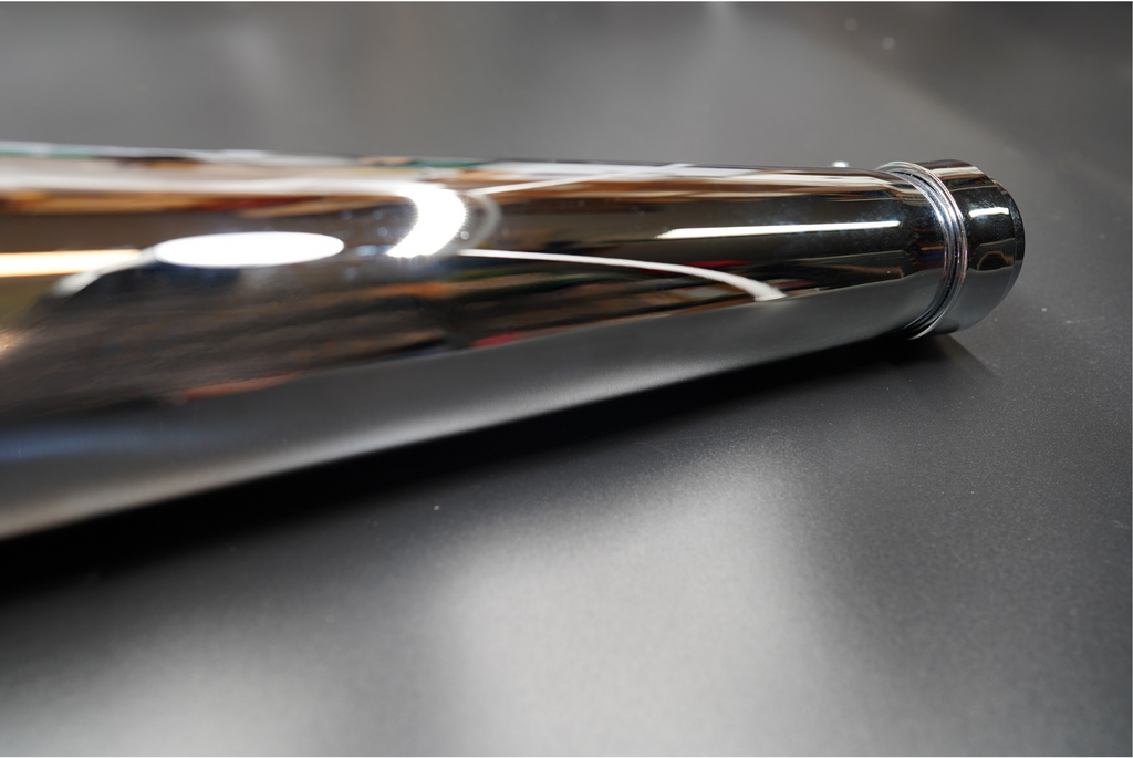 Matte black exhaust tip detail with visible baffle texture.