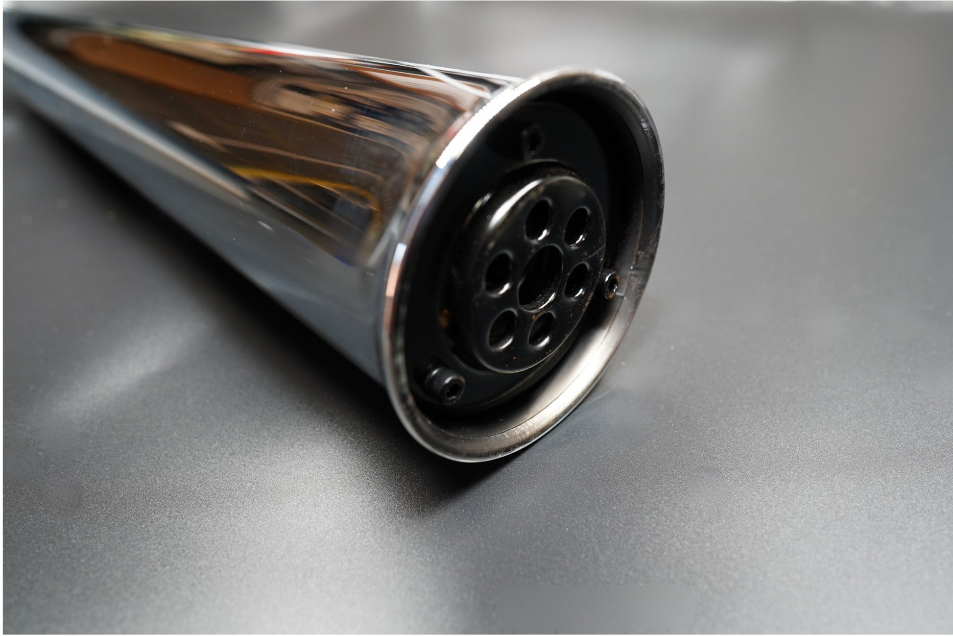 Chrome finish rear exhaust tip close-up with clean polish. 