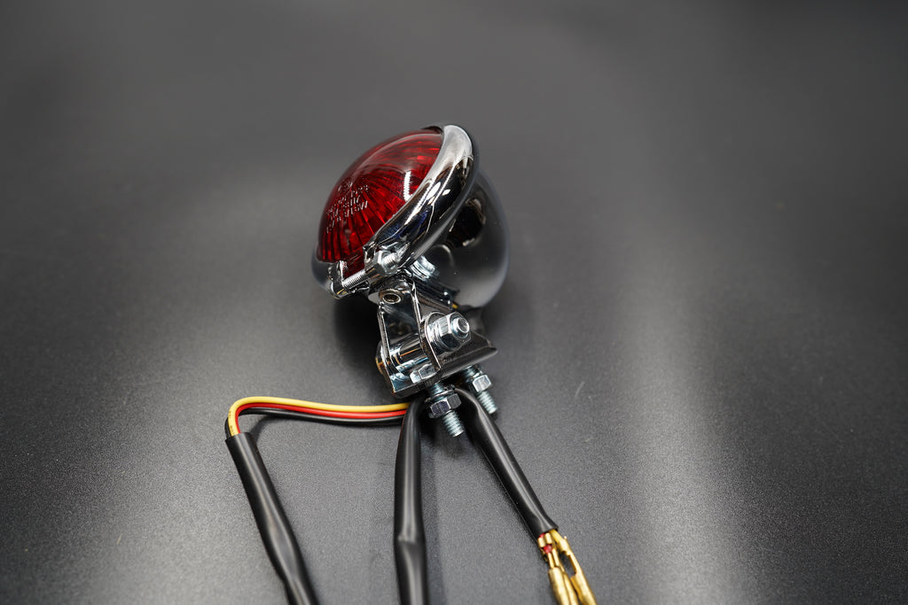 Comparison of matte black and chrome versions side by side — understated, timeless lighting design.