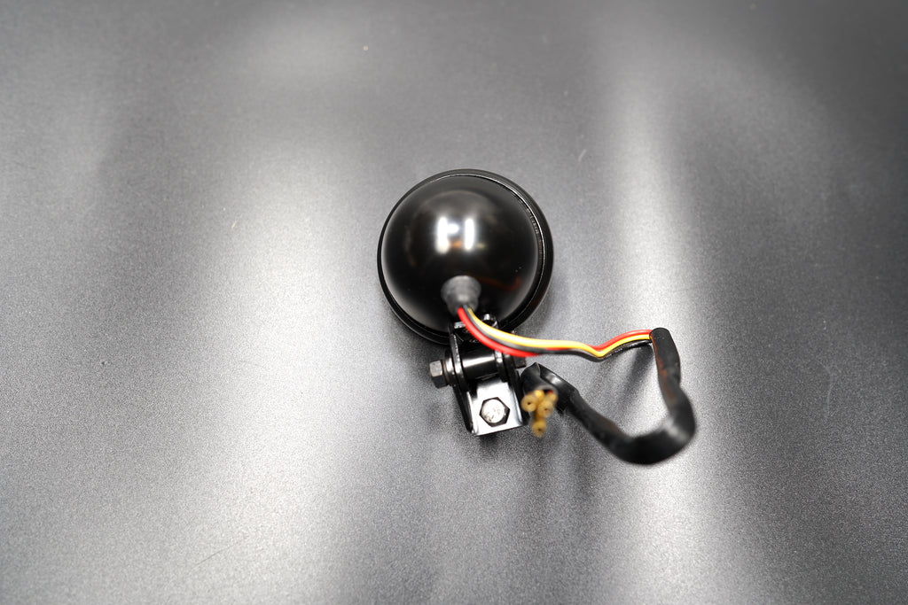 Matte black version of vintage-style LED tail light — minimalist and stealth look for stripped-back bikes.