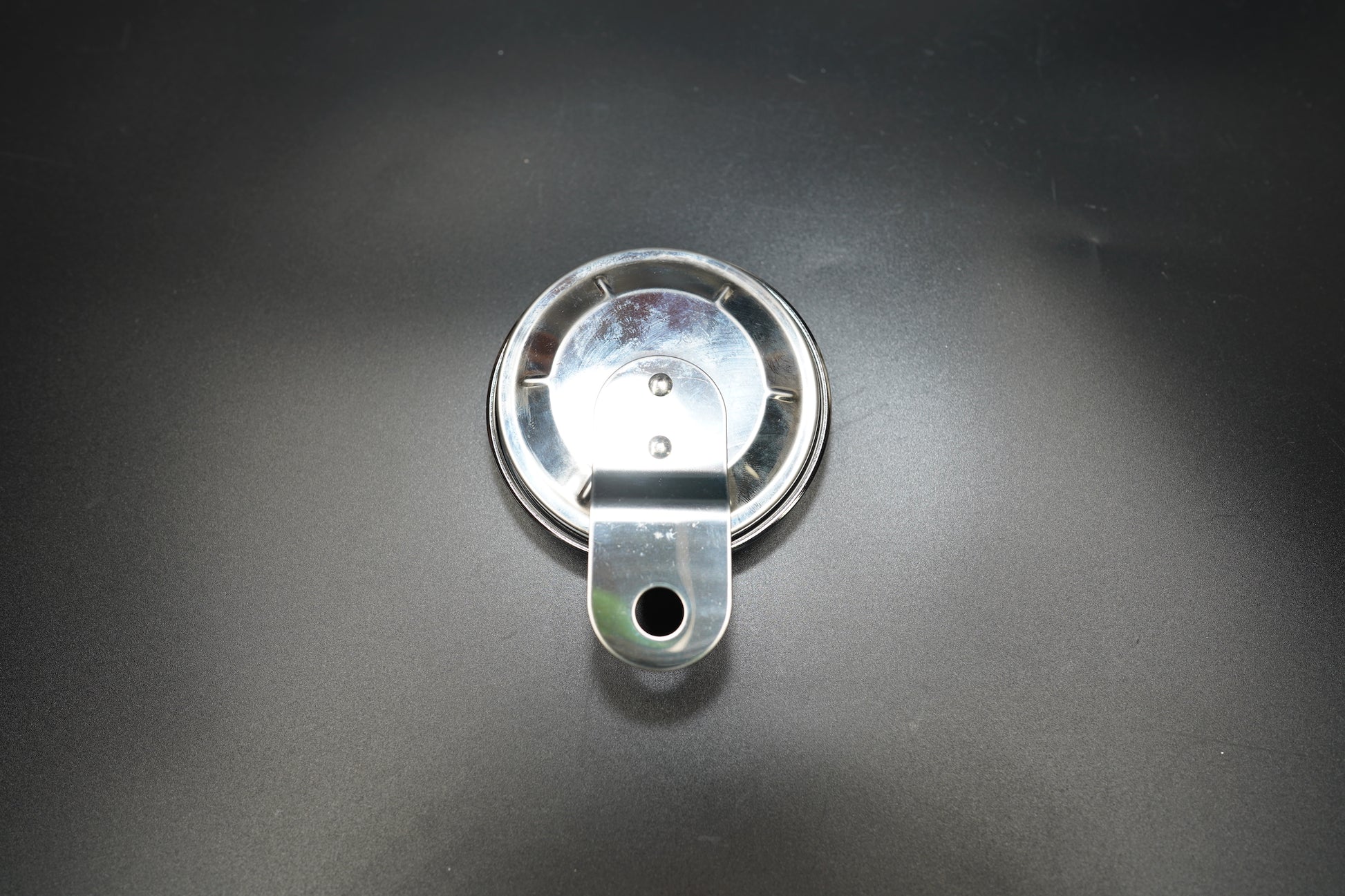 Lower perspective view showing plate thickness and attachment point 