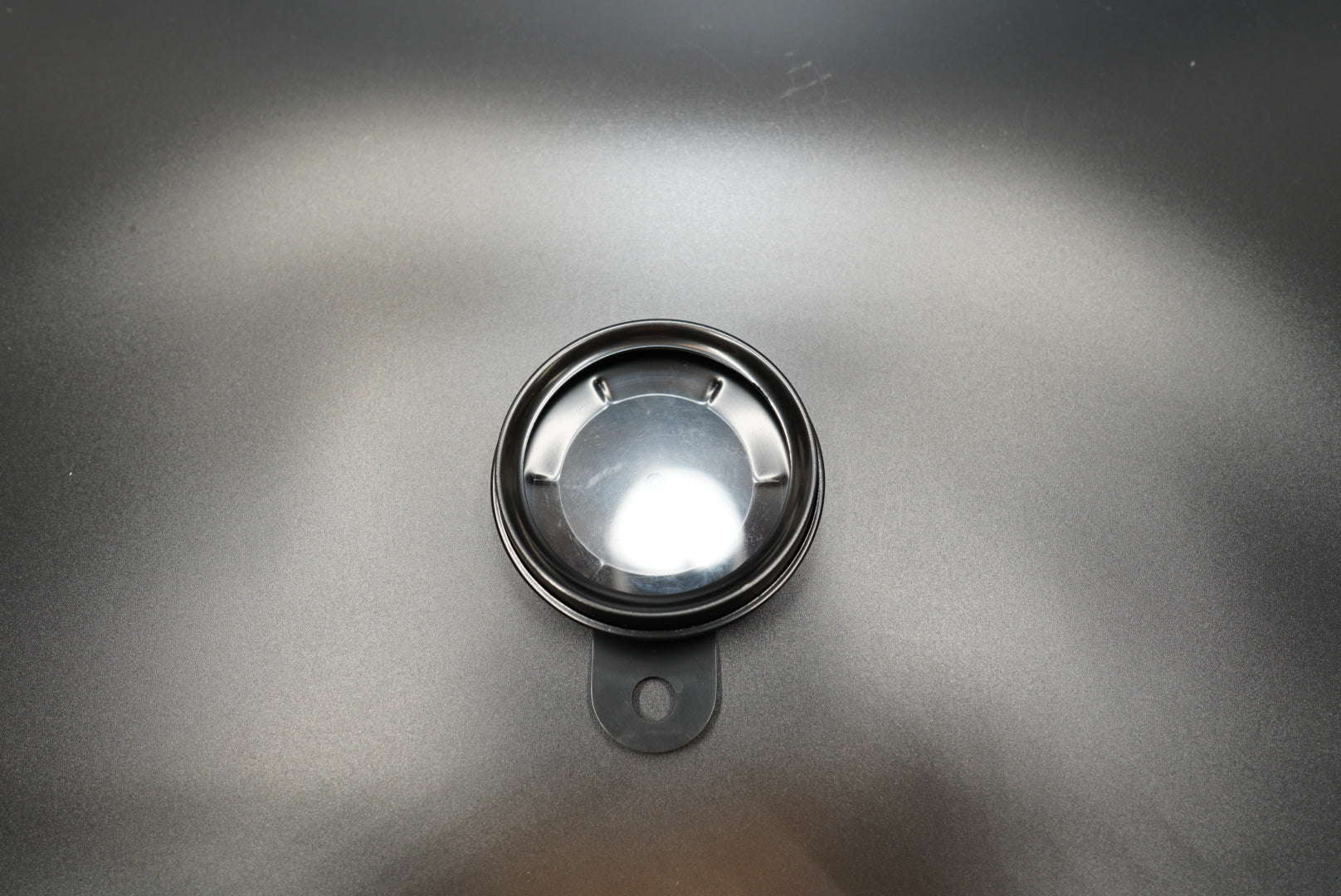 Top-down view showing circular design and matte finish option 