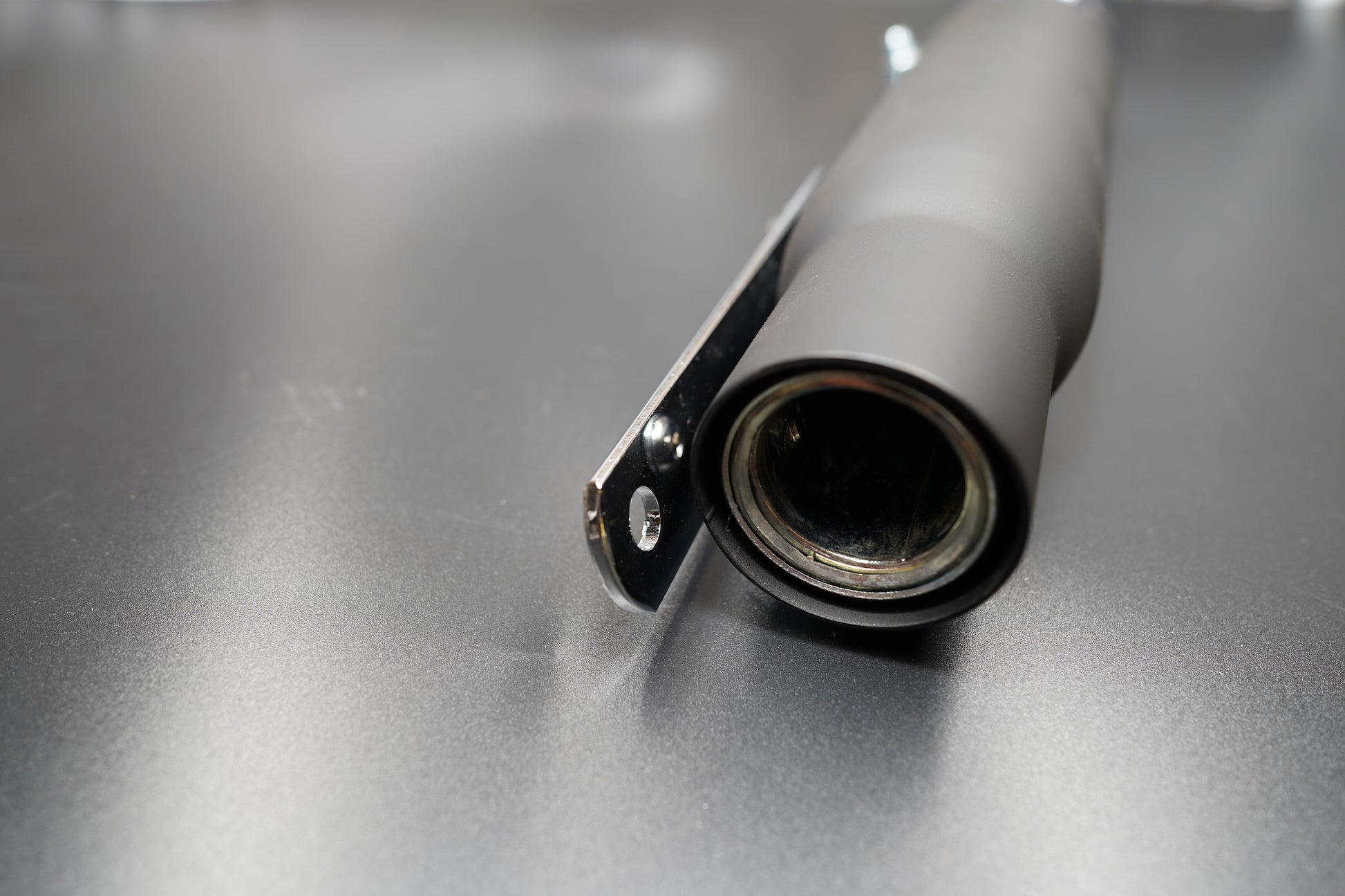 Black finish end detail showing inner baffle
