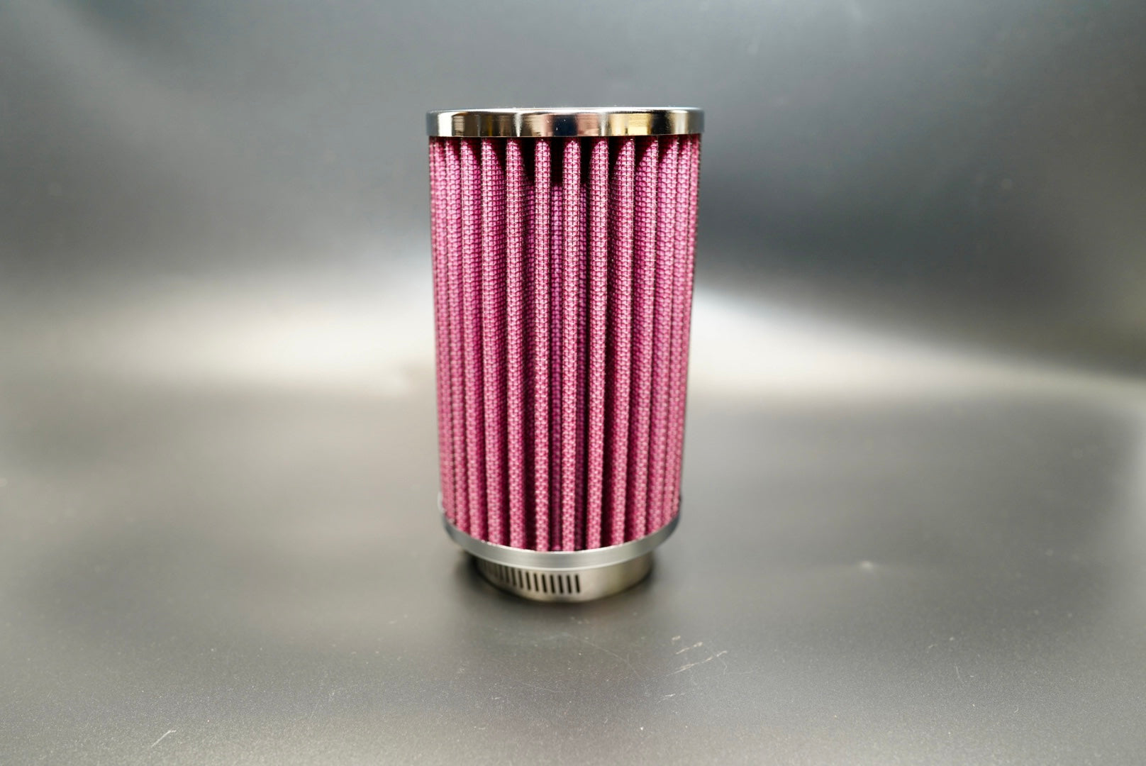 Vintage-style performance air filter with pleated cotton gauze and chrome cap, front view