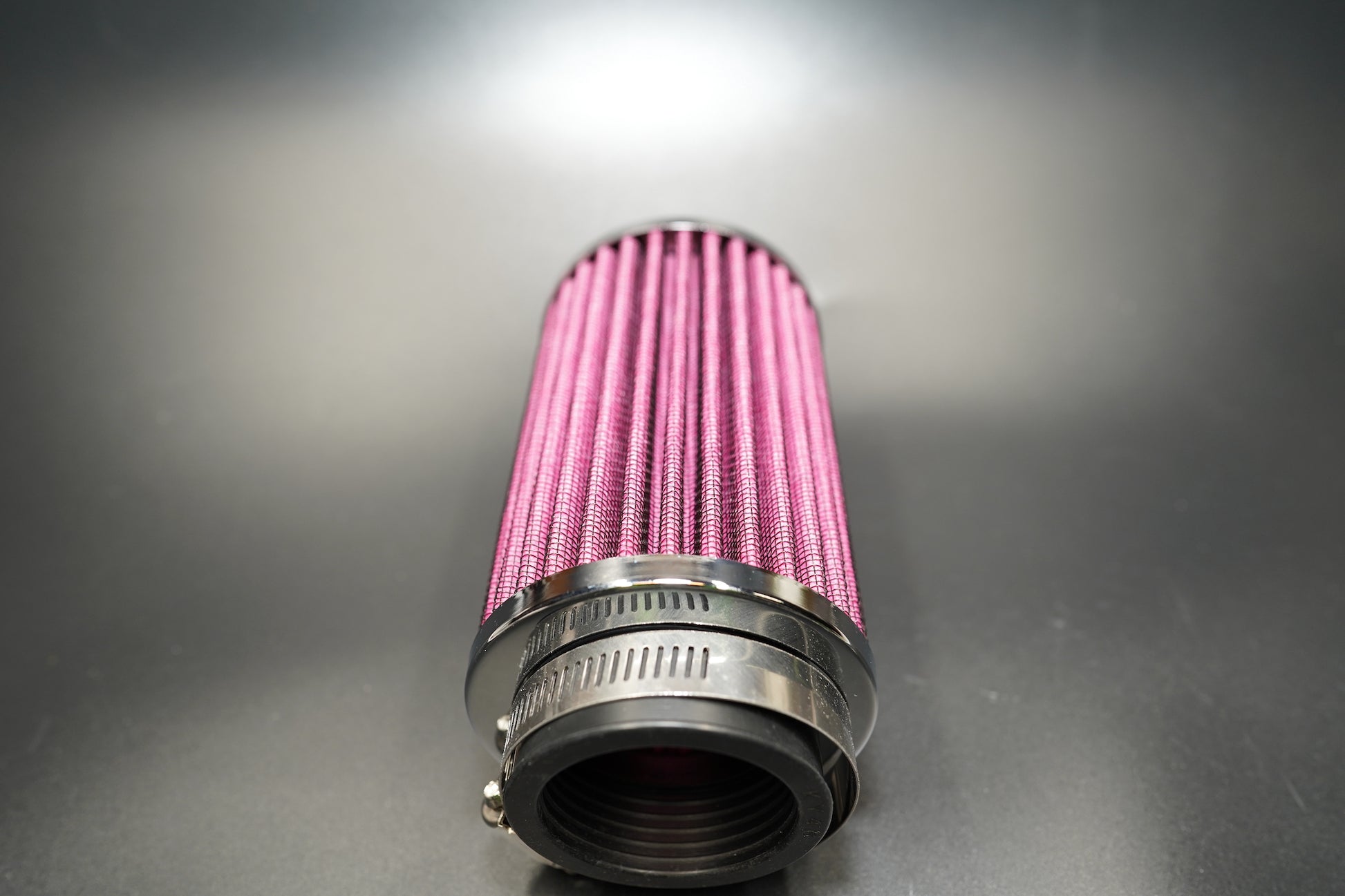 Top-down view showcasing polished chrome finish and fine pleated structure.