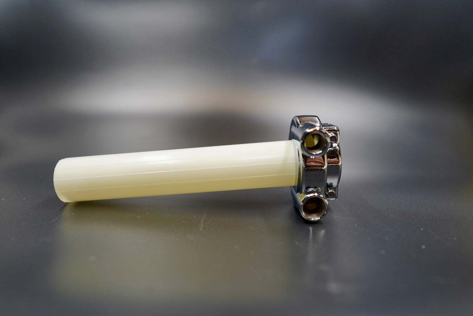 Vintage chrome throttle assembly front angle showing polished body and dual cable entry